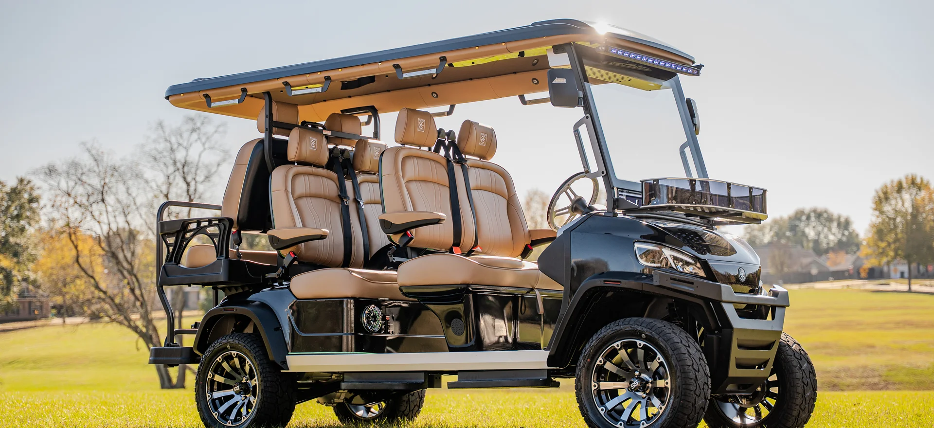 Black lifted Conquest S six-seat golf cart with tan seats, available in Dallas
