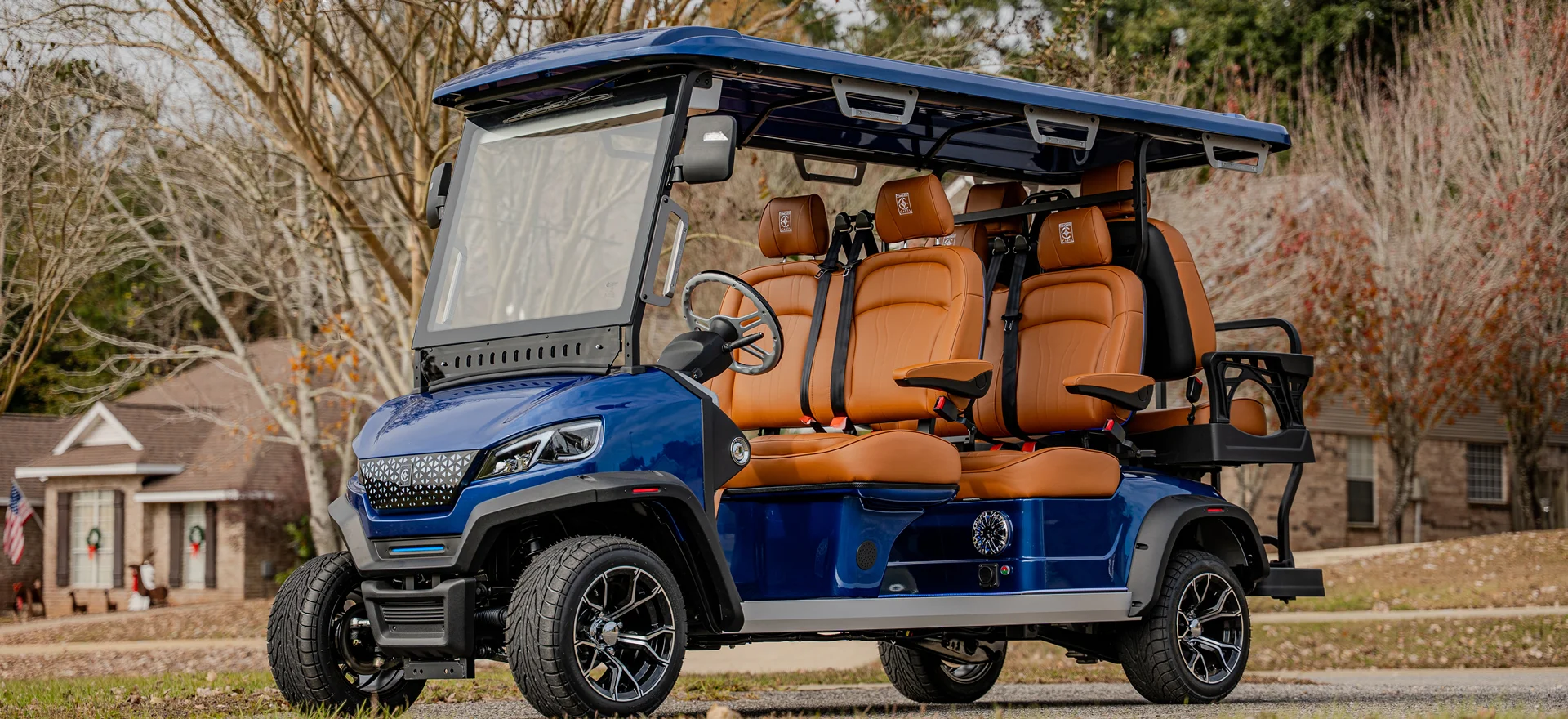 Blue Conquest S 6 six-seat lithium golf cart in a Dallas neighborhood