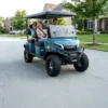Family riding in a blue Kandi Kruiser 4Pro Forward on a neighborhood street