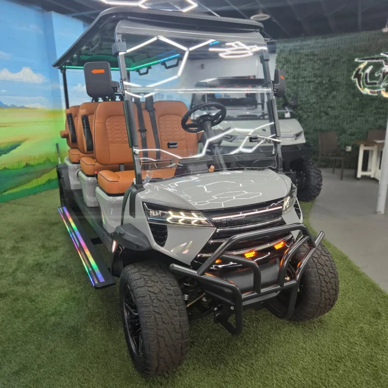 EDGE EV Phantom 6 in Nardo Gray with saddle brown seats, brush guard and LED running boards, front view at the Family Golf Carts Dallas showroom